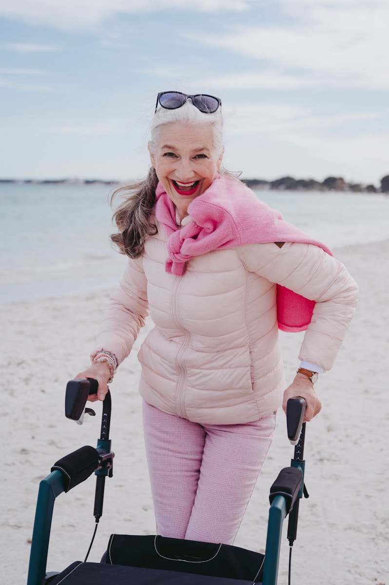 a woman with a walker on the beach