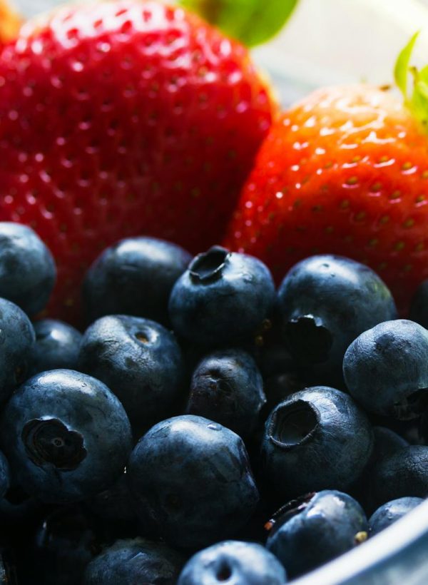 Black Berries Served Beside Strawberry on Clear Glass Bowl